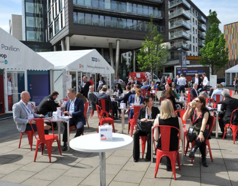 People sitting at tables outside at UKREiiF 2022